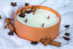 Scented candle in a clay jar